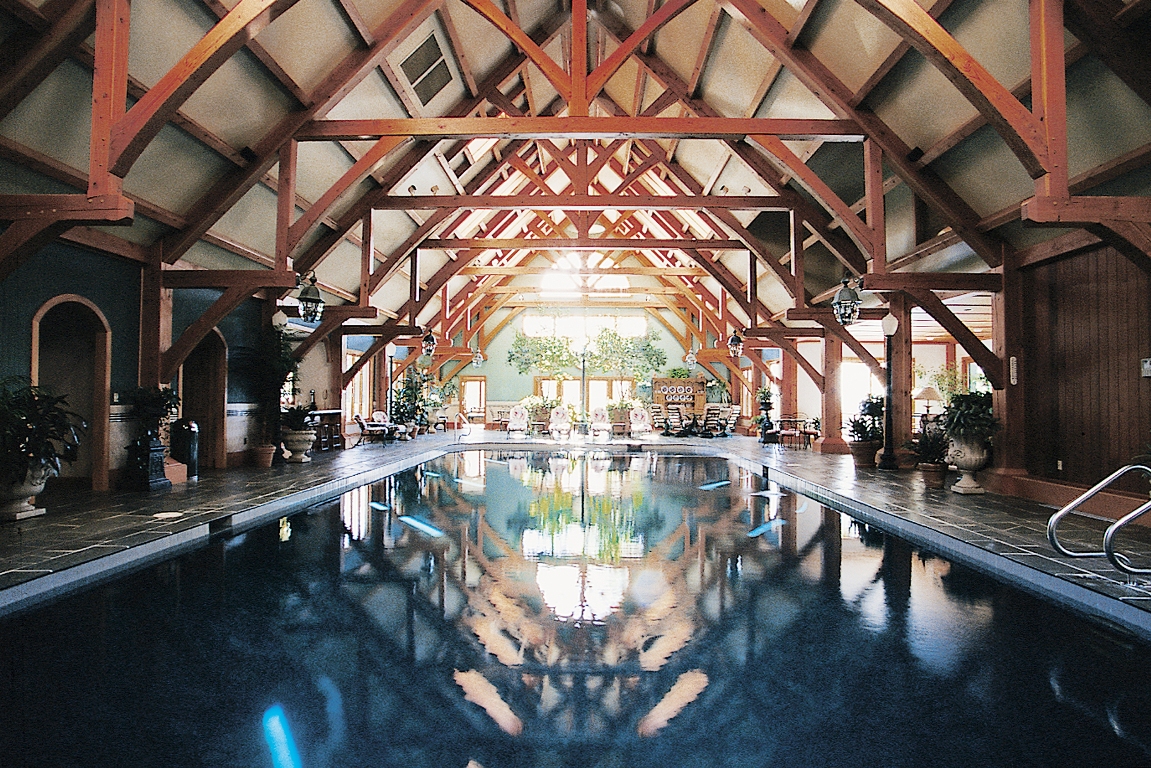 Interior Design of Indoor Pool Beams Showing Arched Braces and Timbers