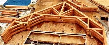 Timber Bents with Arched Beams Ready to Raise