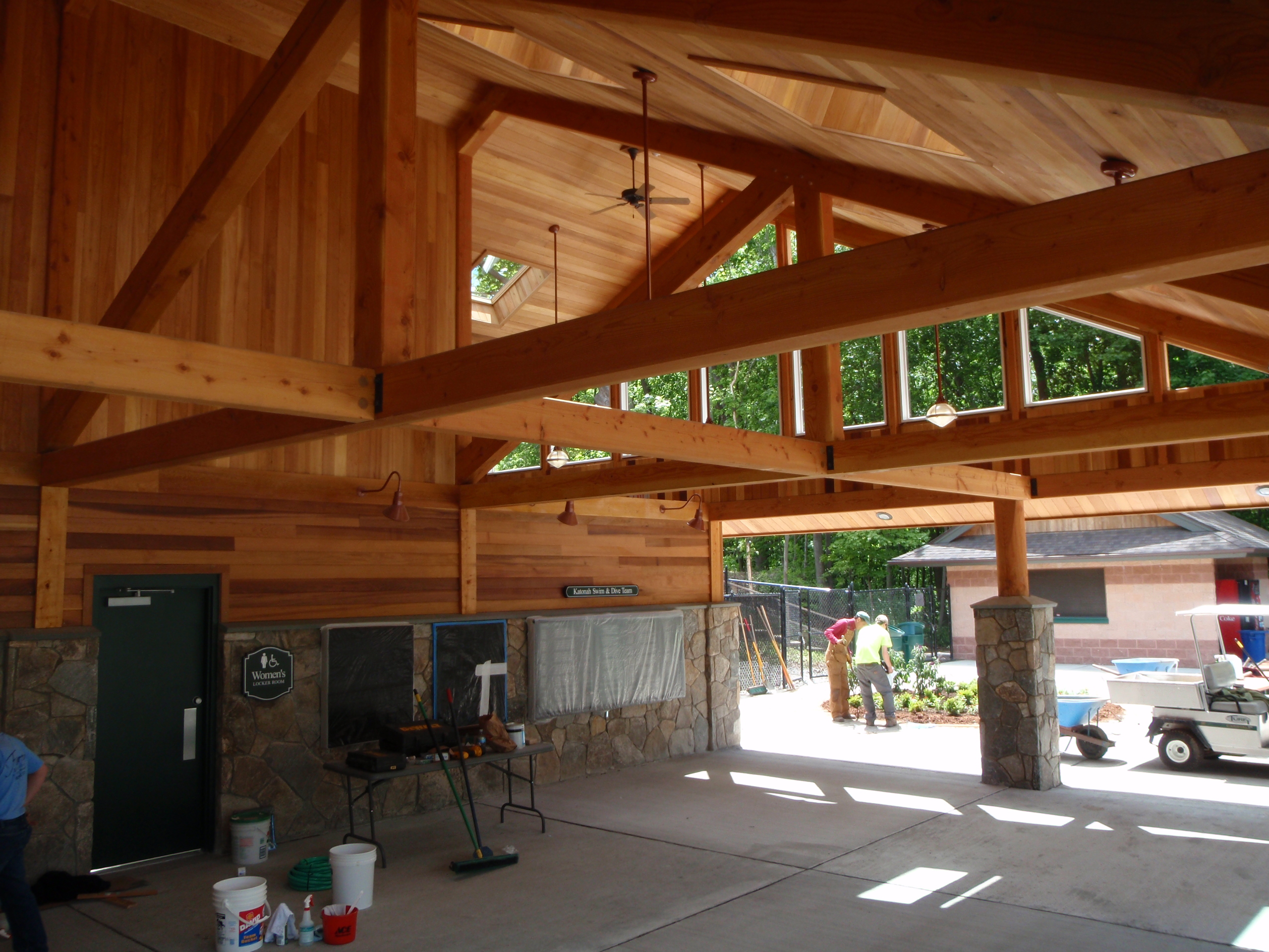 Interior of Bathhouse with timber Trusses and Glass Gable 