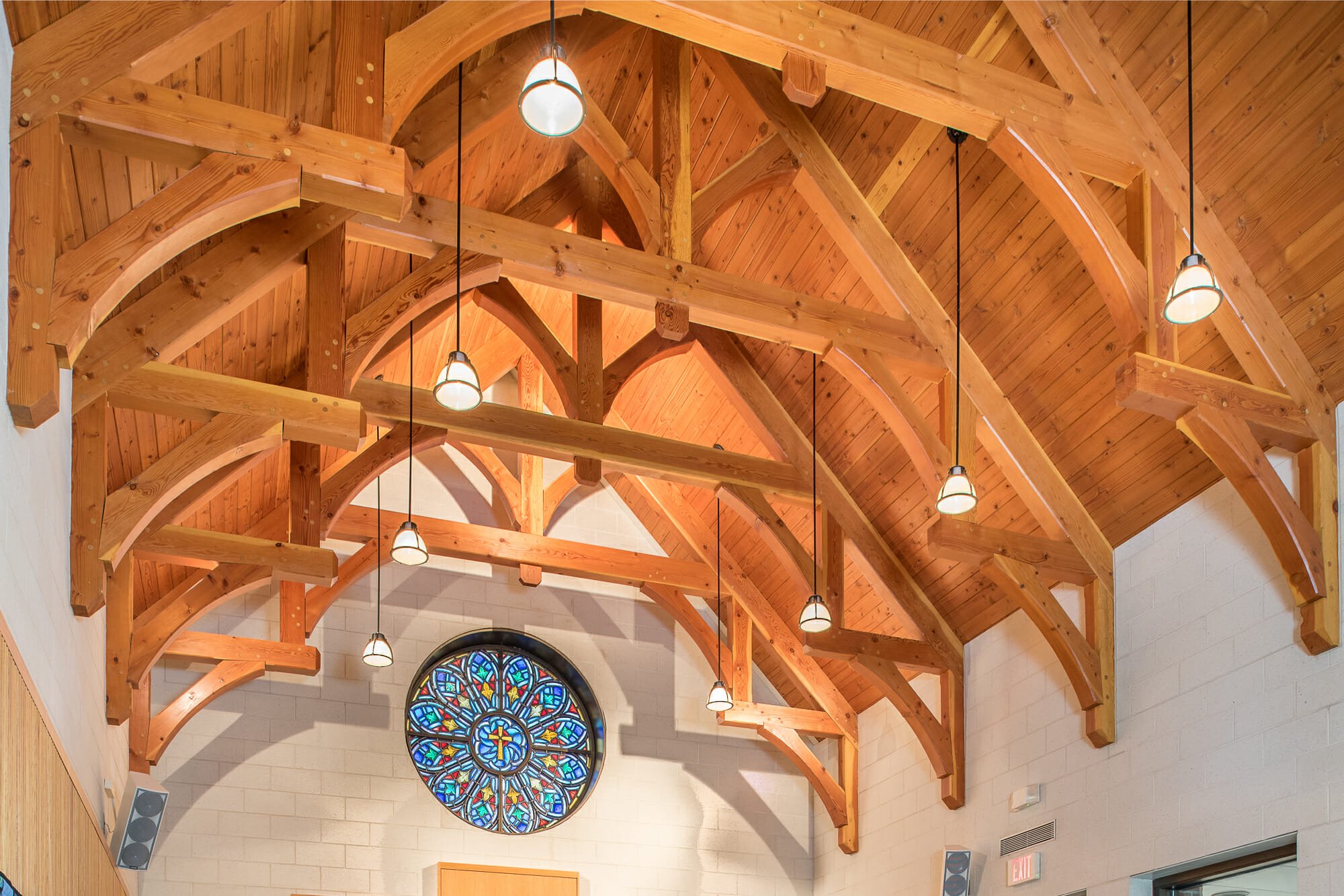 Interior of Westminster Presbyterian Church with Hammer Trusses and Stained Glass window