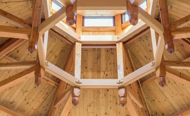 Close up of the steel compression ring and timbers in the Octagon Timber Frame in the Chapel for Holy Apostles Church