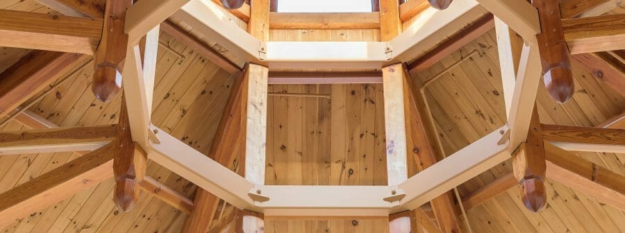 Close up of the steel compression ring and timbers in the Octagon Timber Frame in the Chapel for Holy Apostles Church