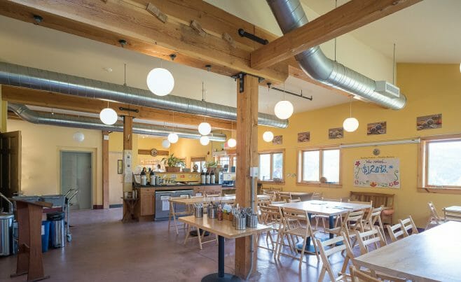 Interior Timber Frame Cafe with Steel Brackets in the Badger Balm Factory in Gilsum, NH