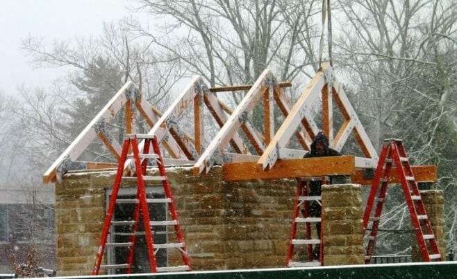Vermont Timber Workers Installing Trusses in the Snow