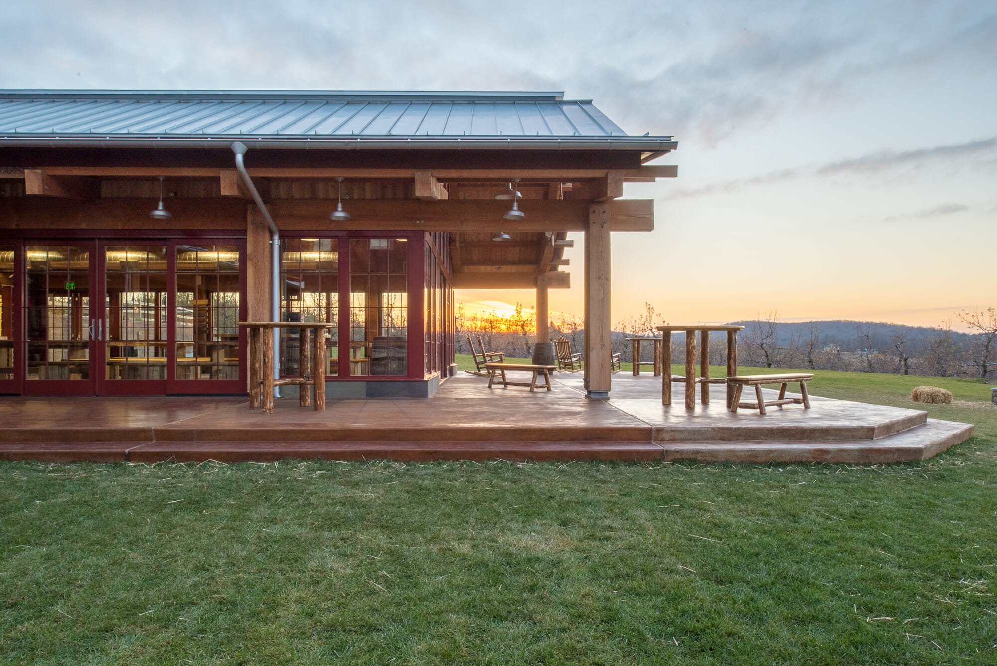 heavy timber building with a wrap around porch