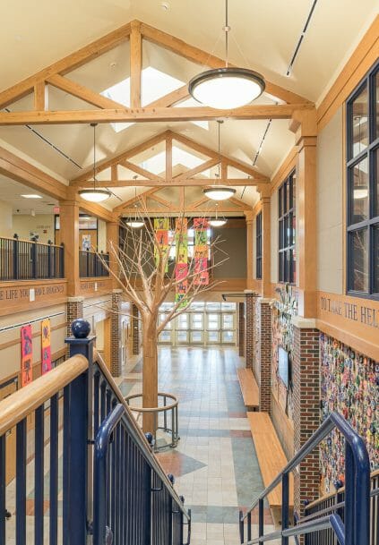 Interior of Westbrook Middle School with King post trusses in ME