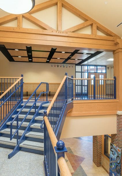 Interior of Westbrook Middle School with King post trusses in ME