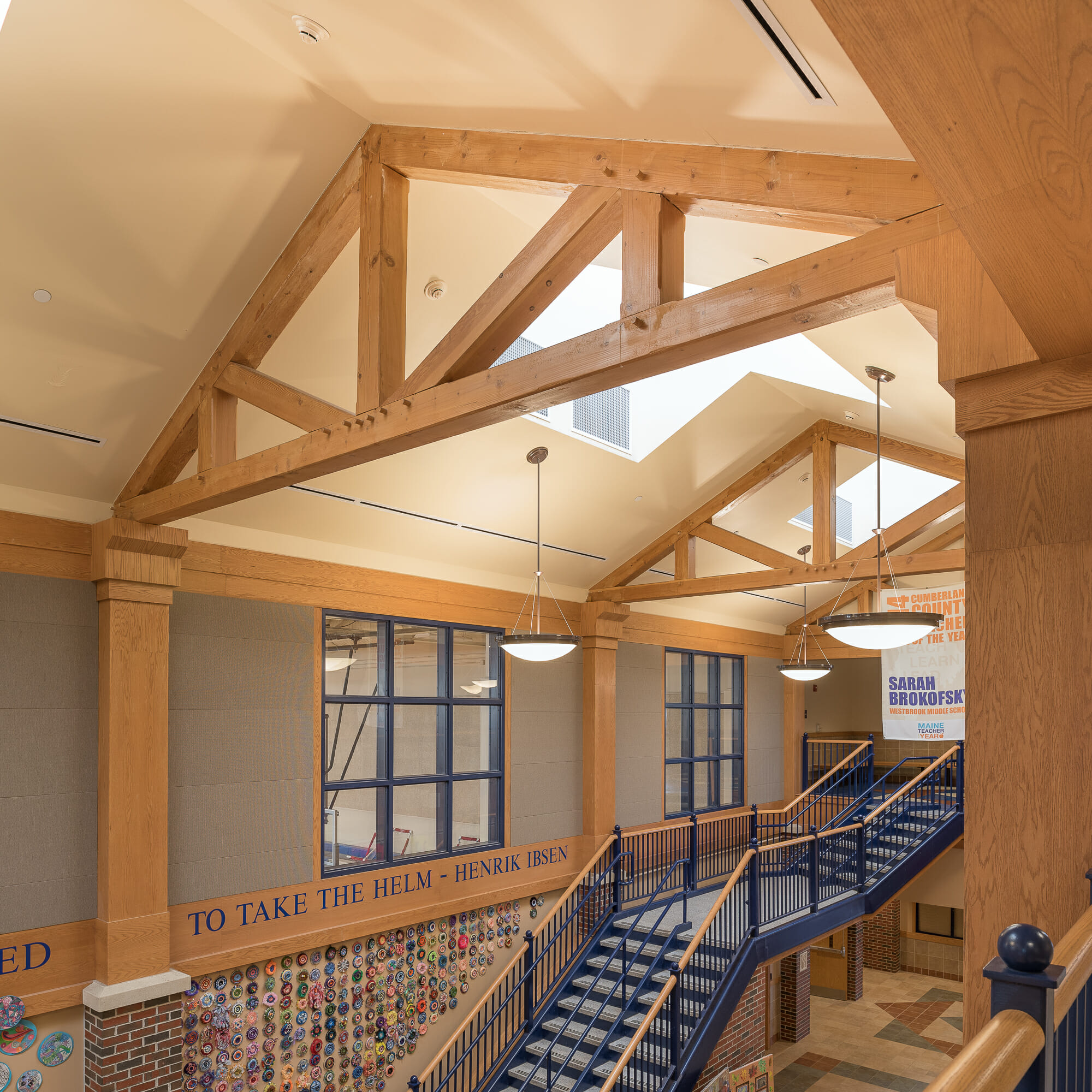 Interior of Westbrook Middle School with King post trusses in ME