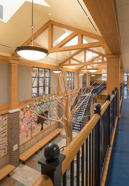 Interior of Westbrook Middle School with King post trusses in ME