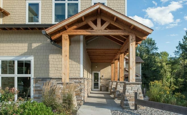 Heavy Timber Porte Cochere Entry Way with King Posts Outside of a Pediatric Dentist Office