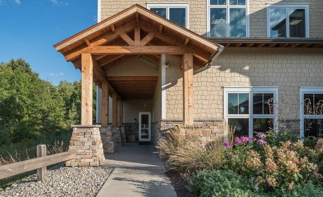 Heavy Timber Porte Cochere Entry Way with King Posts Outside of a Pediatric Dentist Office