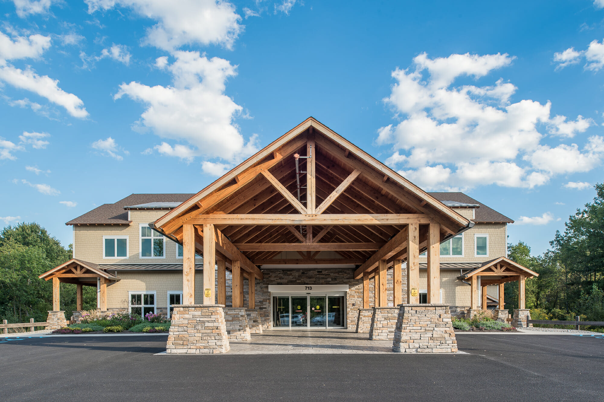 Heavy Timber Porte Cochere Entry Way with King Posts Outside of a Pediatric Dentist Office