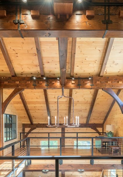 Black Cherry Keys and Steel Straps on Timber Beams in a Barn Style Home in NH