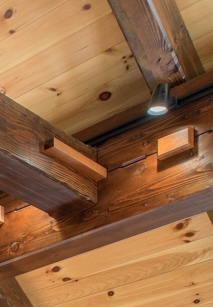 Black Cherry Keys and Steel Straps on Timber Beams in a Barn Style Home in NH
