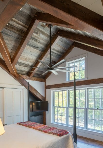 Interior Bedroom with overhead Beams in a Barn Style Home in NH