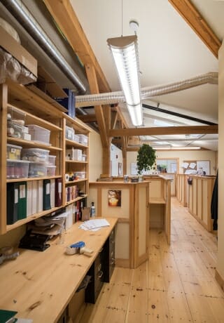 A Work Space with Timber Beams in the Badger Balm Factory in Gilsum, NH