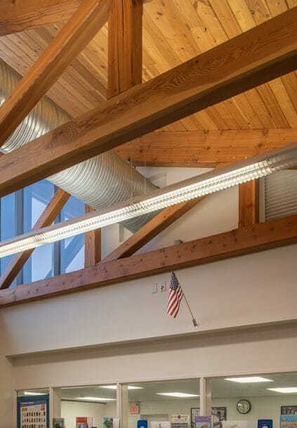 Interior of the Library with Timber Trusses in the Rippowam Cisqua School in NY.