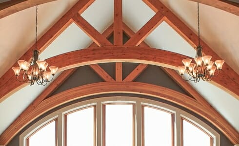 Arched Trusses in a timber frame home. Daignault Residence.