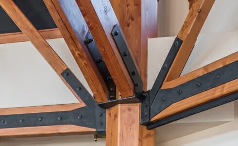 Details of Timber and Steel Joinery in the Spruce Peak Base Camp Octagon Timber Frame