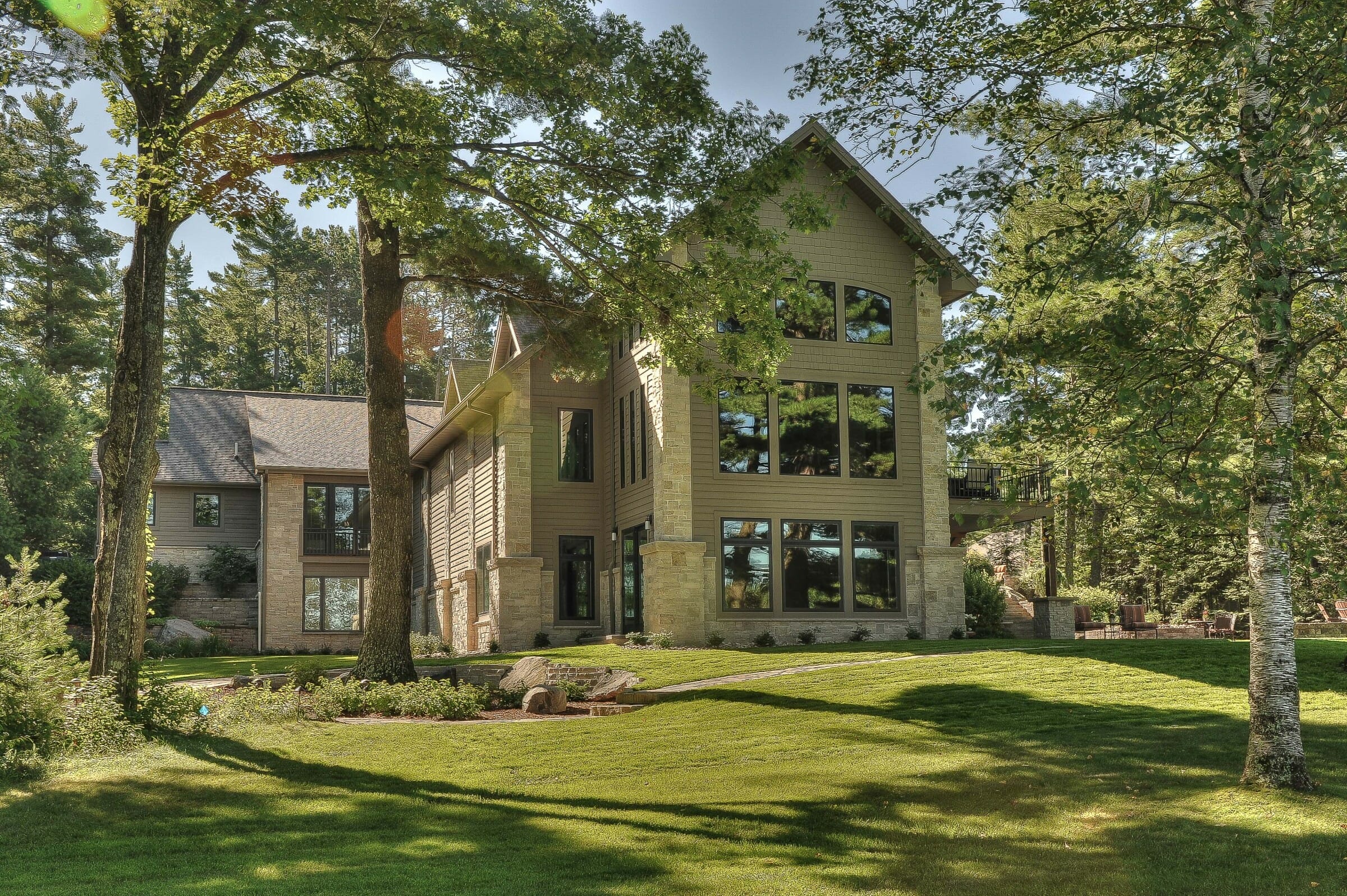 Exterior of a Timber Frame Home with patios and balconies.