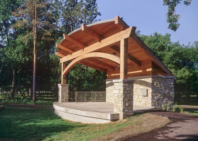 Outdoor Theater with Timber Posts, an Arched Beam and a Sturdy Timber Roof