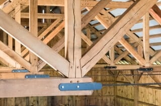 Oak Timber Frame with Steel Tie Rods in Traditional Rich Barn
