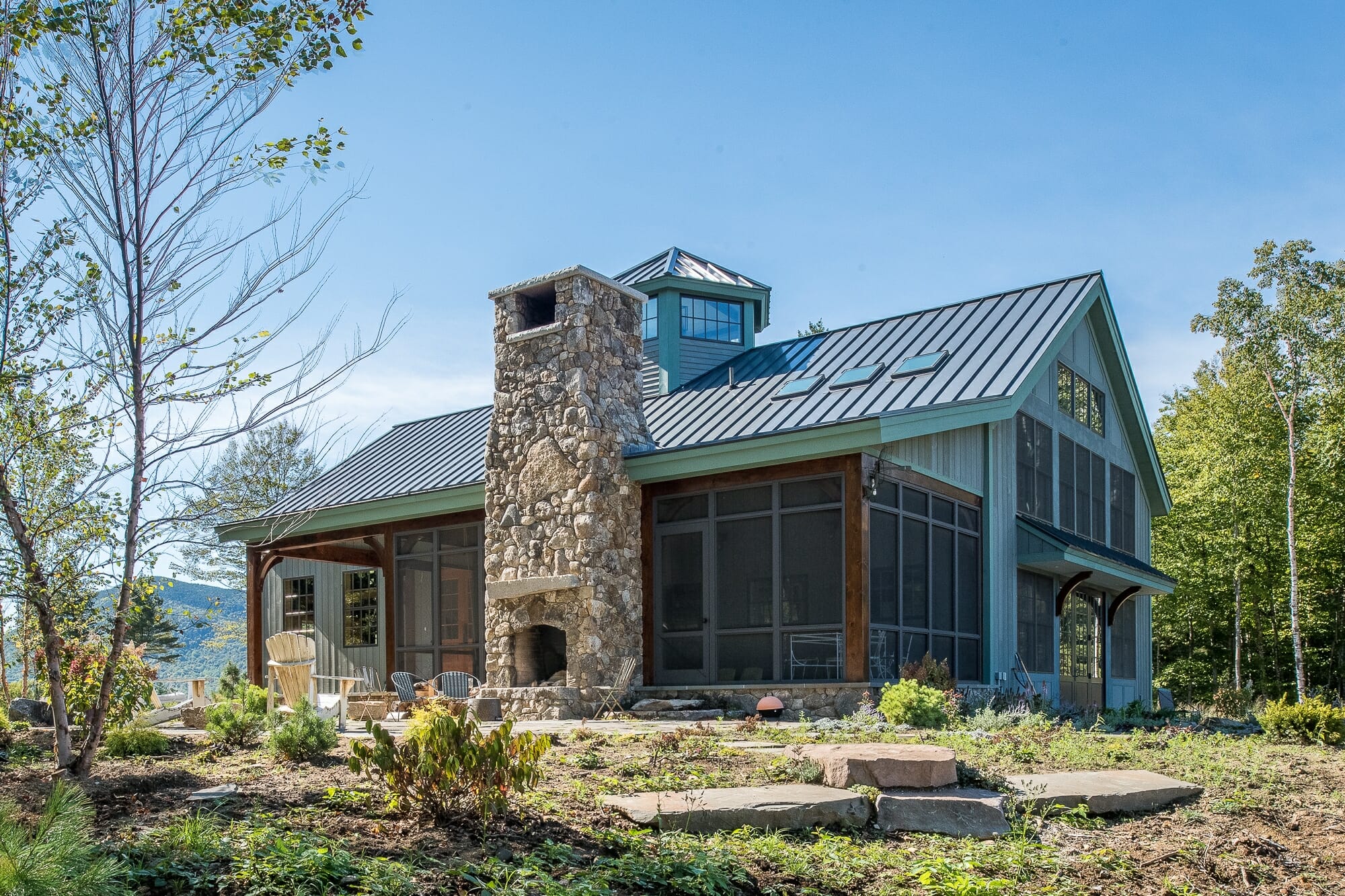 Exterior of the off the grid timber frame Barn style home in Sandwich NH