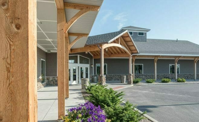 Heavy Timber Porte Cochere Entry Way and Timber Posts at Lenny's Shoe Store with rough sawn hemlock and glulam arches