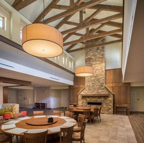 The King Post Trusses in the Christina Seix Academy in Trenton, NJ were made with Kiln-dried Douglas fir. The King Post Trusses highlight the cathedral ceiling and tall stone fireplace.