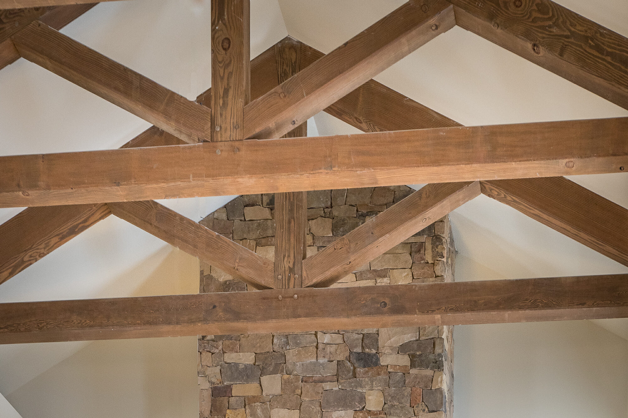 The King Post Trusses in the Christina Seix Academy in Trenton, NJ were made with Kiln-dried Douglas fir. The King Post Trusses highlight the cathedral ceiling and tall stone fireplace.