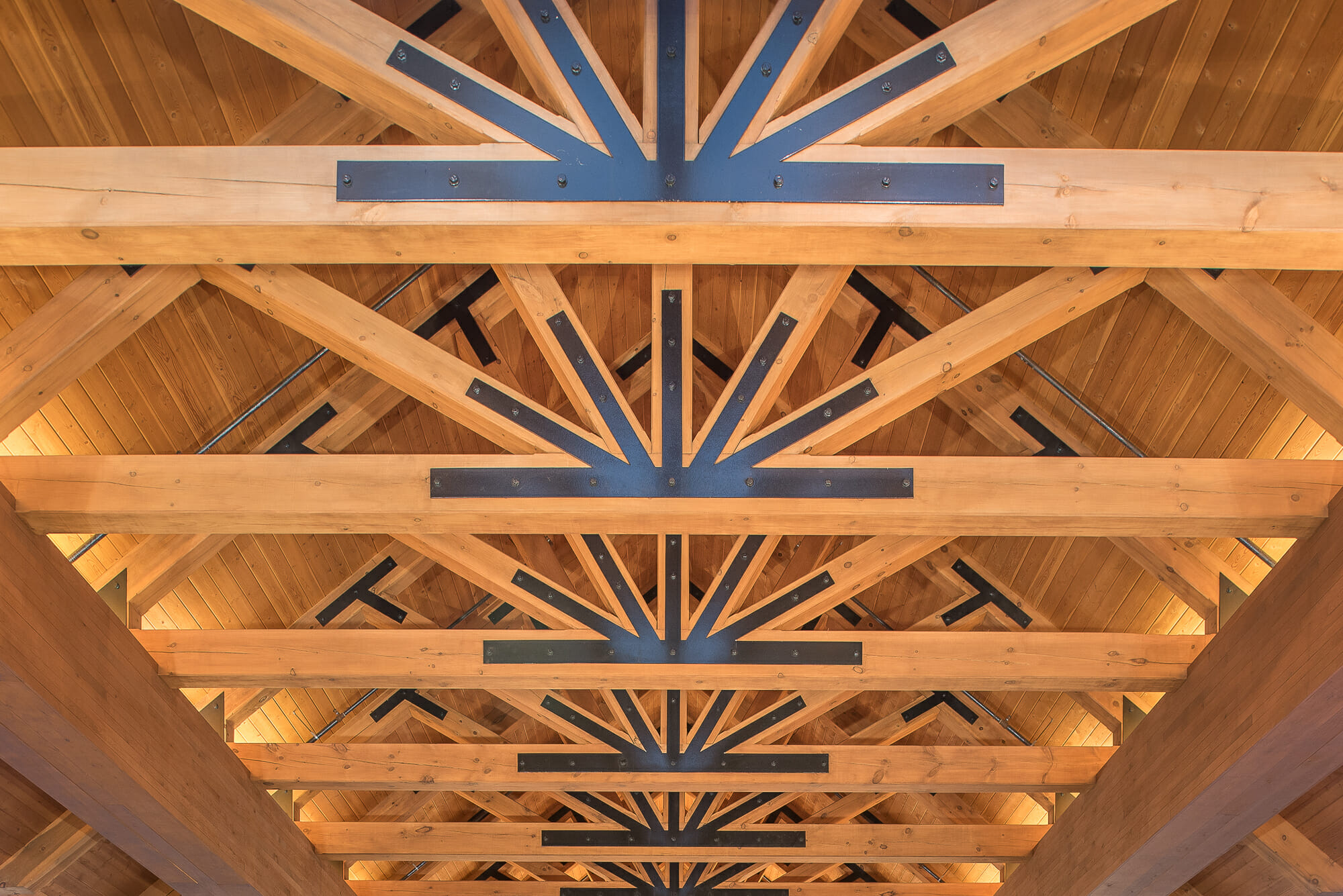 Heavy Timber Porte Cochere Entry Way at the Oxford Casino in Maine with King post trusses in White Pine with steel plates.