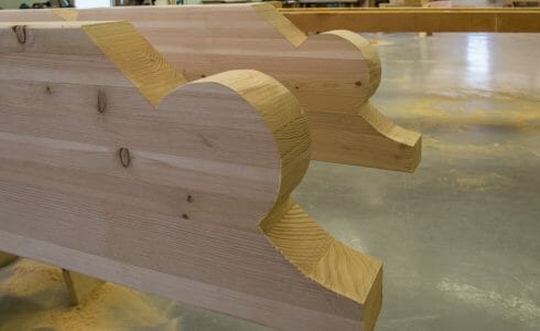 The cut timber scrolls for the Porte Cochere at the Mahamudra Buddhist Hermitage