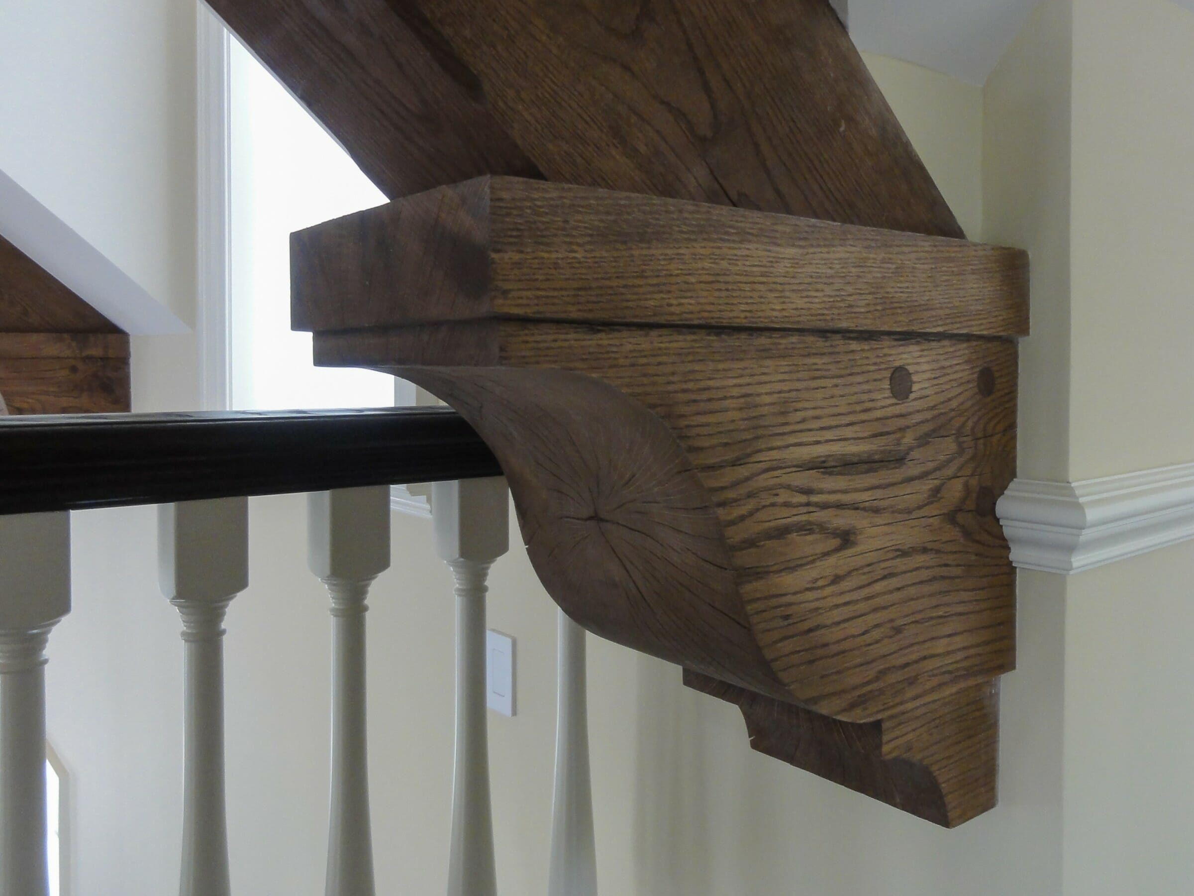 Dark stained wood corbel in a home