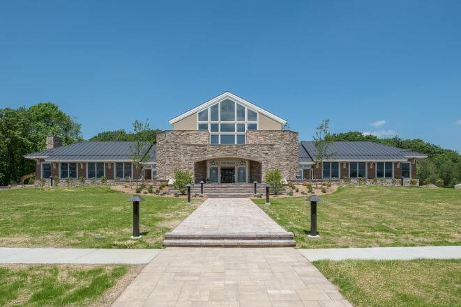 The Mahamudra Buddhist Retreat in Cragsmoor, NY has a heavy timber entry way and interior trusses fabricated from Glulam and Douglas Fir