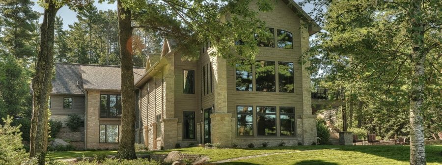 Exterior of the Minocqua Residence that features arched king trusses, cathedral ceilings and windows.