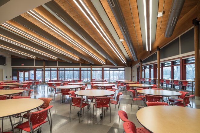 Glulam Posts and beams with black steel in the Magnet School dining cafeteria.