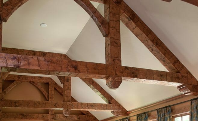 Hand Hewn Corbels and Finials on Trusses in a home