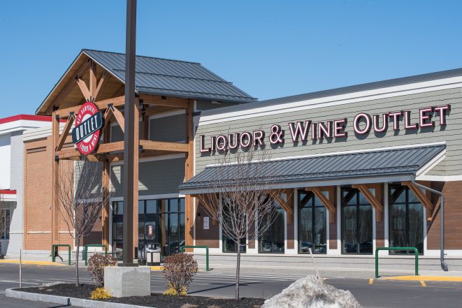 The Woodmont Liquor Store in Londonderry, NH has a Heavy Timber Entryway with black steel galvanized plates built by Vermont Timber Works.