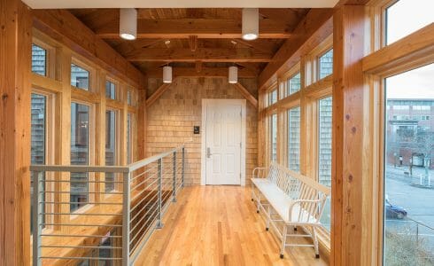 Lofted upstairs area with Large windows and Douglas fir beams in the Port Society Complex