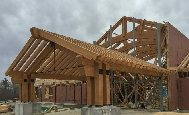 Rafter Scrolls on an assembled Timber Frame Porte Cochere Entry way