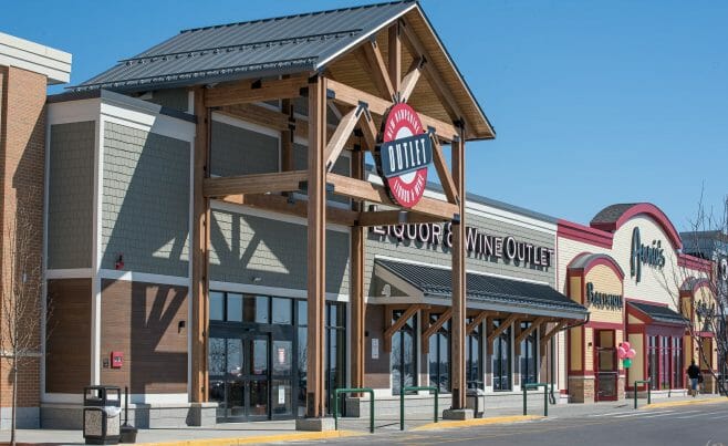 The Woodmont Liquor Store in Londonderry, NH has a Heavy Timber Entryway with black steel galvanized plates built by Vermont Timber Works.