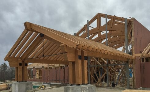 The Mahamudra Buddhist Retreat in Cragsmoor, NY has a heavy timber entry way and interior trusses fabricated from Glulam and Douglas Fir