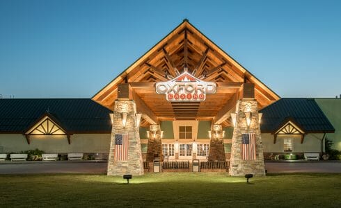 Heavy Timber Porte Cochere Entry Way at the Oxford Casino in Maine with King post trusses in White Pine with steel plates.