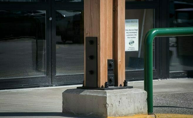 The Woodmont Liquor Store in Londonderry, NH has a Heavy Timber Entryway with black steel galvanized plates built by Vermont Timber Works.