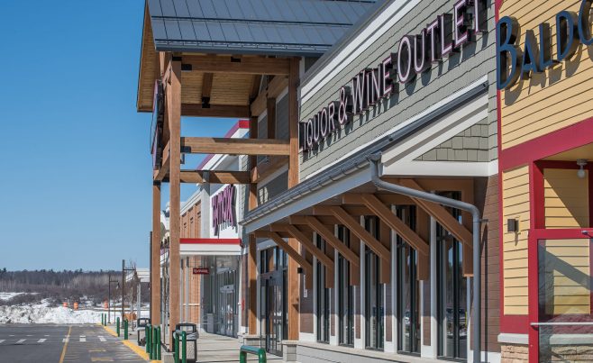 The Woodmont Liquor Store in Londonderry, NH has a Heavy Timber Entryway with black steel galvanized plates built by Vermont Timber Works.