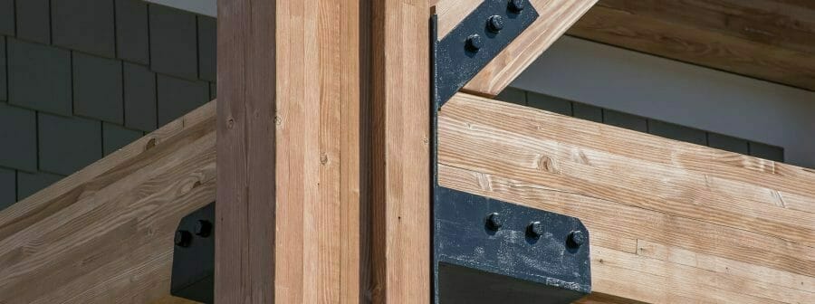 The Woodmont Liquor Store in Londonderry, NH has a Heavy Timber Entryway with black steel galvanized plates built by Vermont Timber Works.