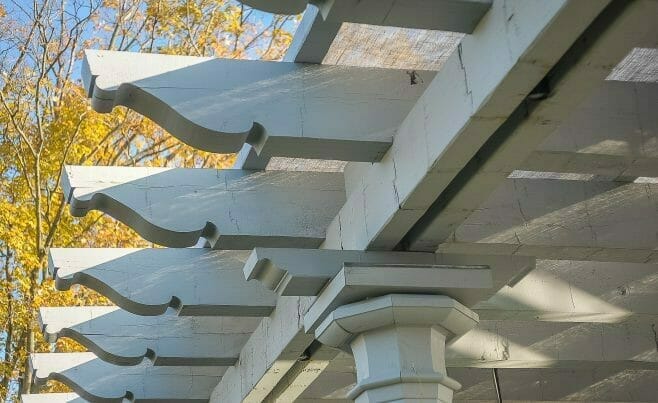 Whitewashed Scrolls on a Timber Frame Pergola