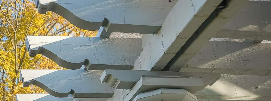 Whitewashed Scrolls on a Timber Frame Pergola