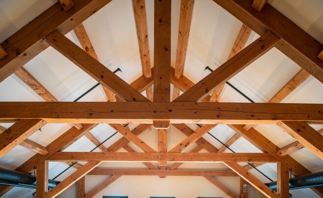 Brigham Hill Barn Interior with Rough Sawn Timber Trusses from Hemlock and White Pine