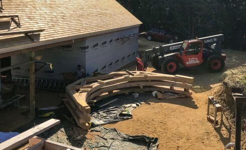 Preparing to lift the reclaimed oak hammer beam trusses at the Seven Gates Residence in Martha's Vineyard